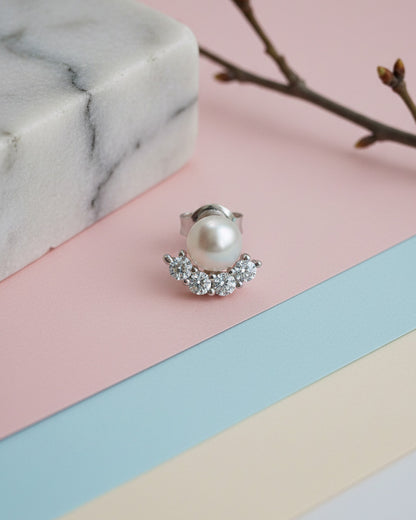 Pearl stud earring with four round CZ stones.