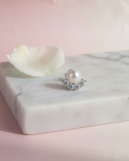 Pearl stud earring with four round CZ stones.