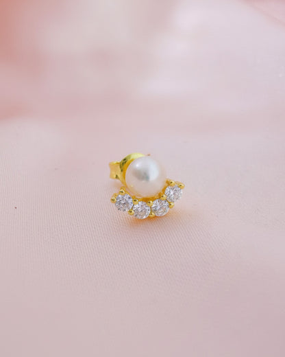 Pearl stud earring with four round CZ stones.