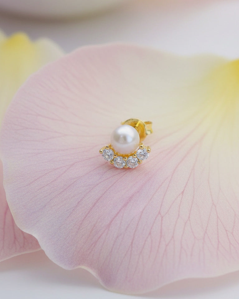 Pearl stud earring with four round CZ stones.