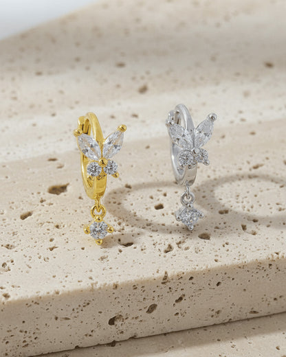 8 mm huggie hoop butterfly earring with dangling round CZ stone.