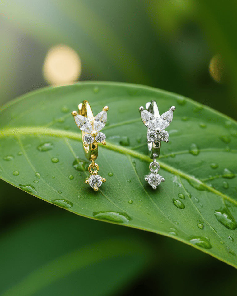8 mm huggie hoop butterfly earring with dangling round CZ stone.