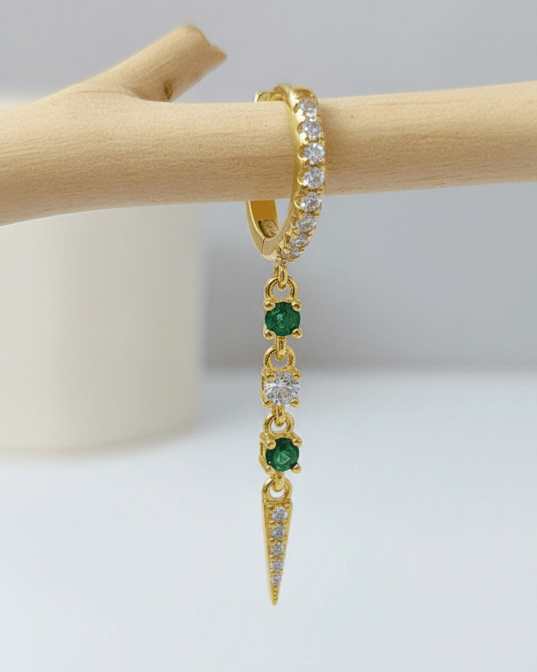 CZ huggie hoop with dangling emerald color and white stones.