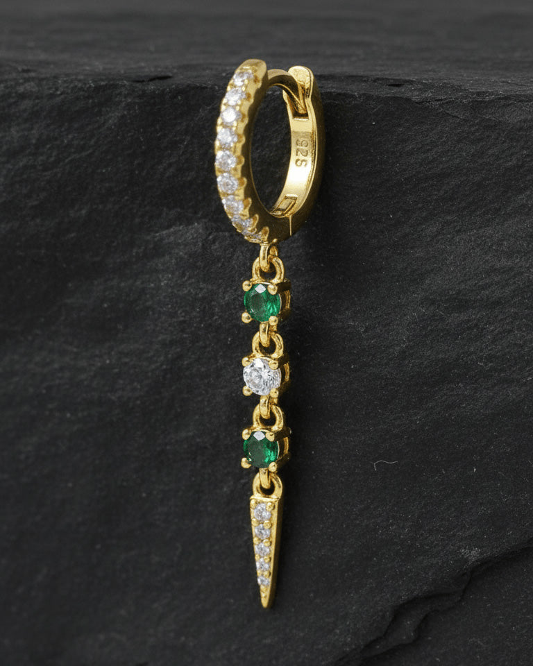 CZ huggie hoop with dangling emerald color and white stones.