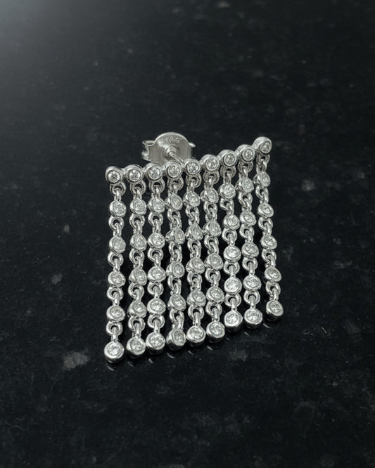 dangling lines of round stones in bezel setting stud earring.