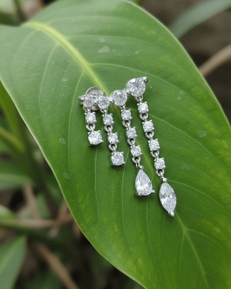 dangling round and fancy shape stones in prong setting stylish earring.