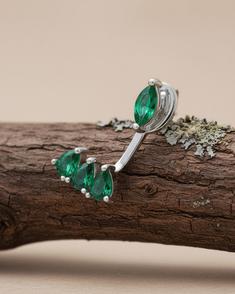 Back and front emerald color marquise and pear shape CZ stones.