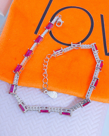 tennis bracelet with rectangualr pink and emerald color CZ.