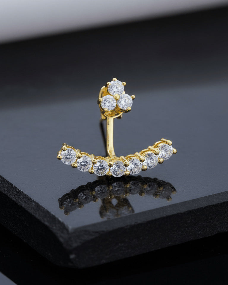 back to front curved line of round CZ stones in prong setting.