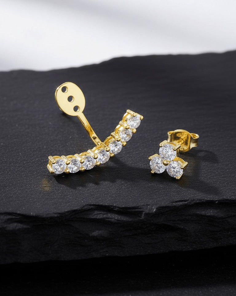 back to front curved line of round CZ stones in prong setting.