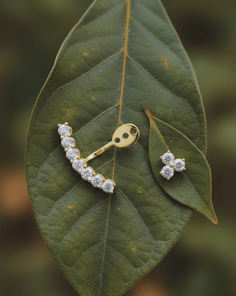 back to front curved line of round CZ stones in prong setting.