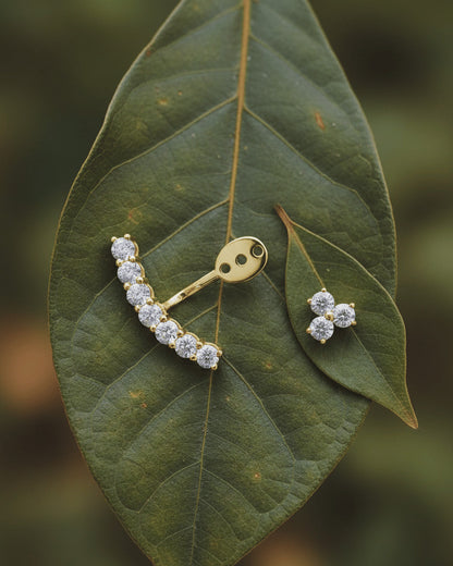 back to front curved line of round CZ stones in prong setting.