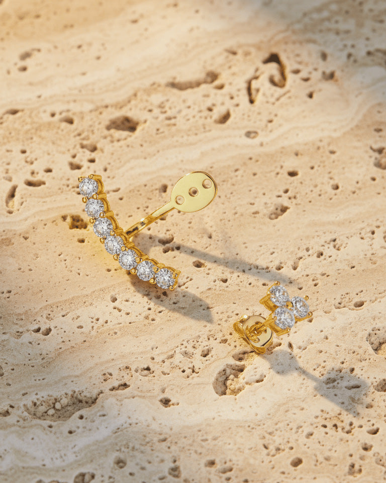 back to front curved line of round CZ stones in prong setting.
