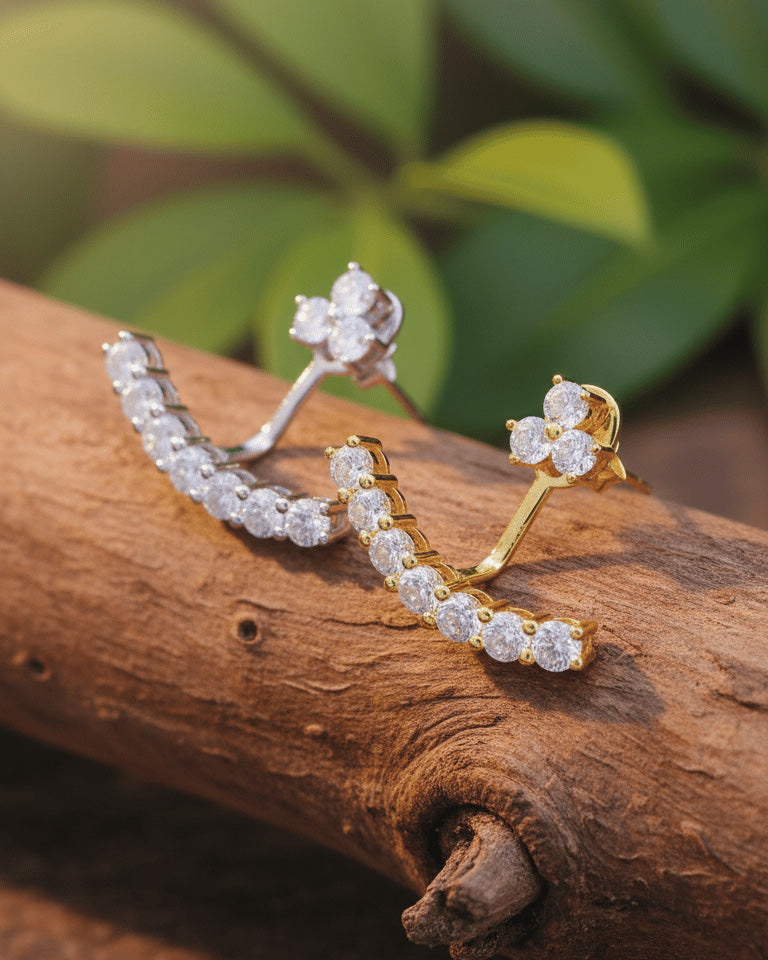 back to front curved line of round CZ stones in prong setting.