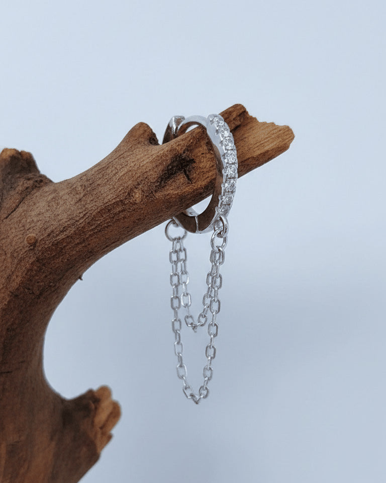 huggie hoop with double dangling chain.