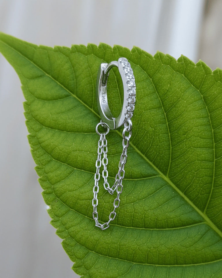 huggie hoop with double dangling chain.