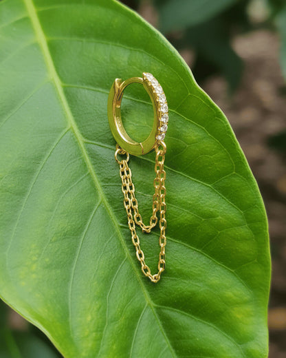 huggie hoop with double dangling chain.