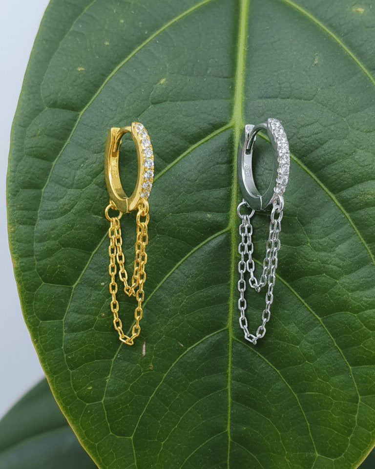 huggie hoop with double dangling chain.