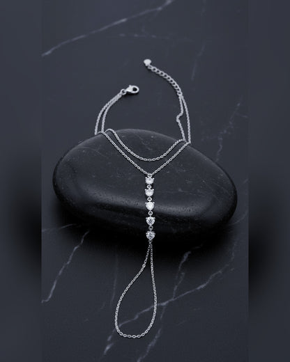 Delicate chain handpiece of five round CZ stones.