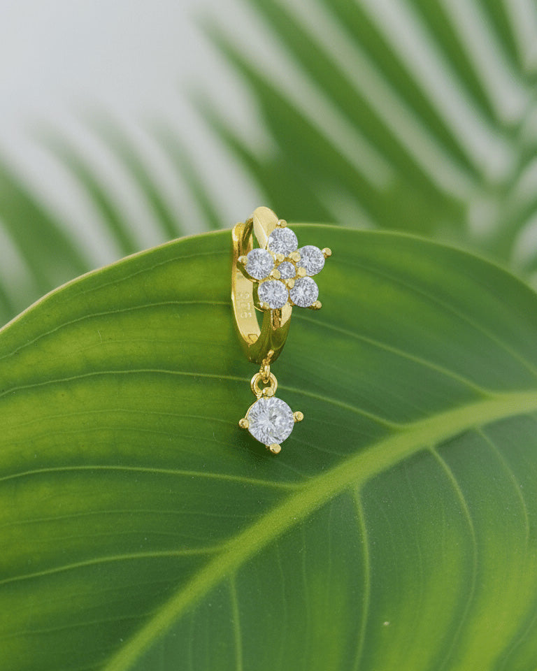 8 mm huggie flower cluster setting huggie hoop earring with dangling stone.