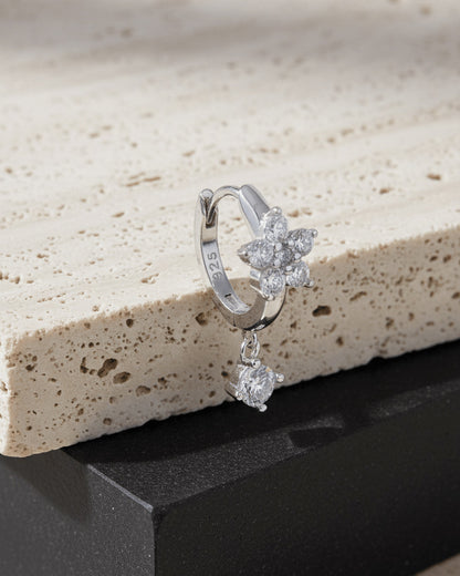 8 mm huggie flower cluster setting huggie hoop earring with dangling stone.