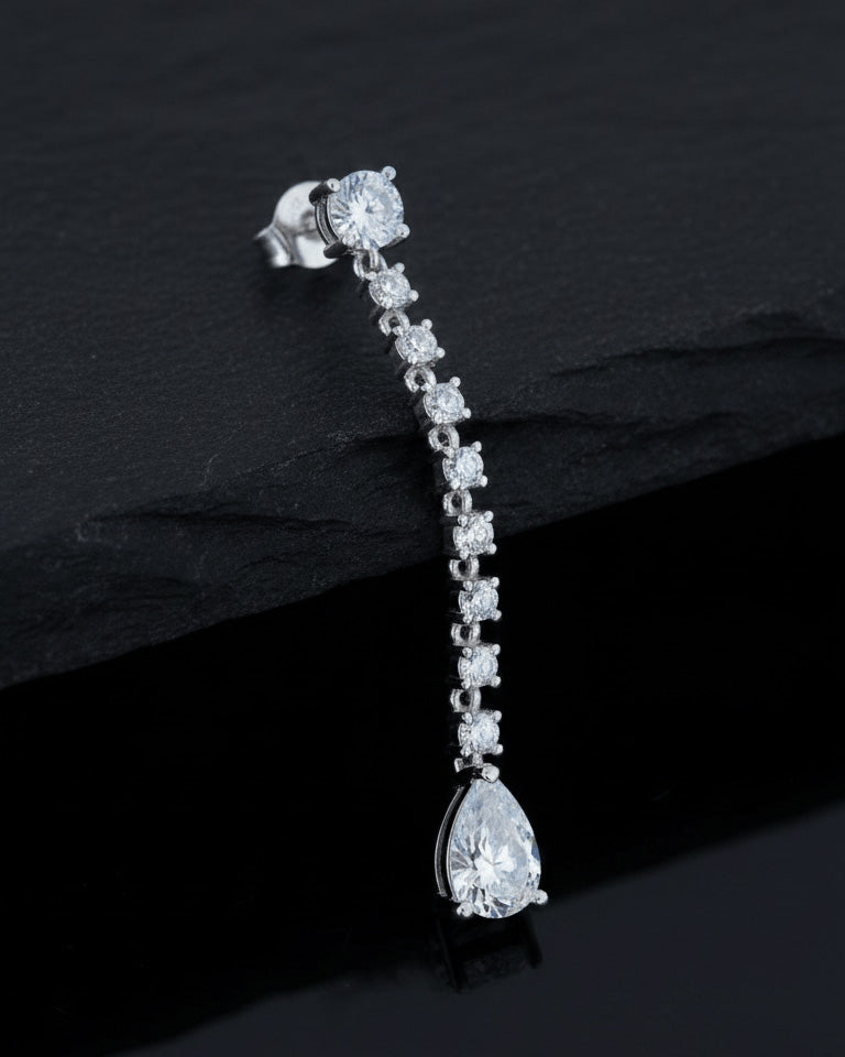 elegant line of round CZ stones ending with a pear shape stud earring.