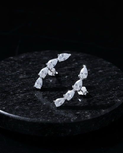 curved bar of four pear shape stones stud earring.