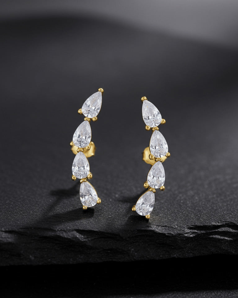 curved bar of four pear shape stones stud earring.