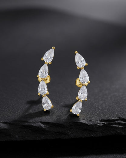 curved bar of four pear shape stones stud earring.