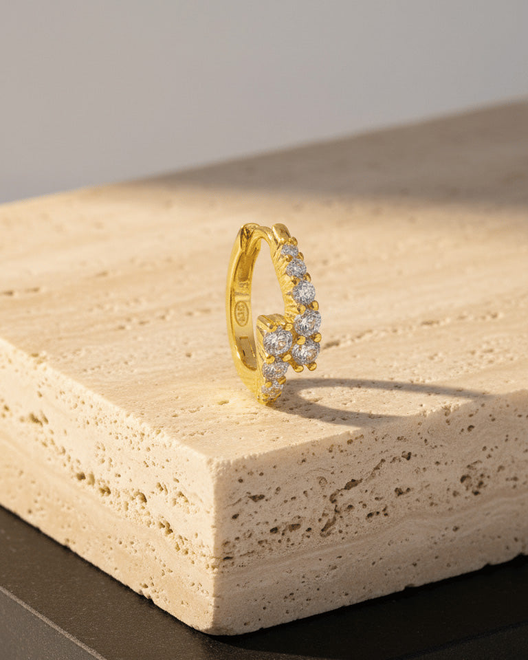 uneven one line huggie hoop earring.