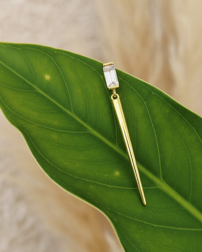Baguette stone stud earring with dangling cone shape.