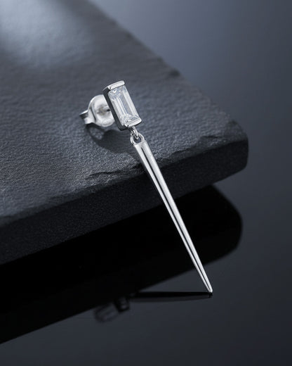 Baguette stone stud earring with dangling cone shape.