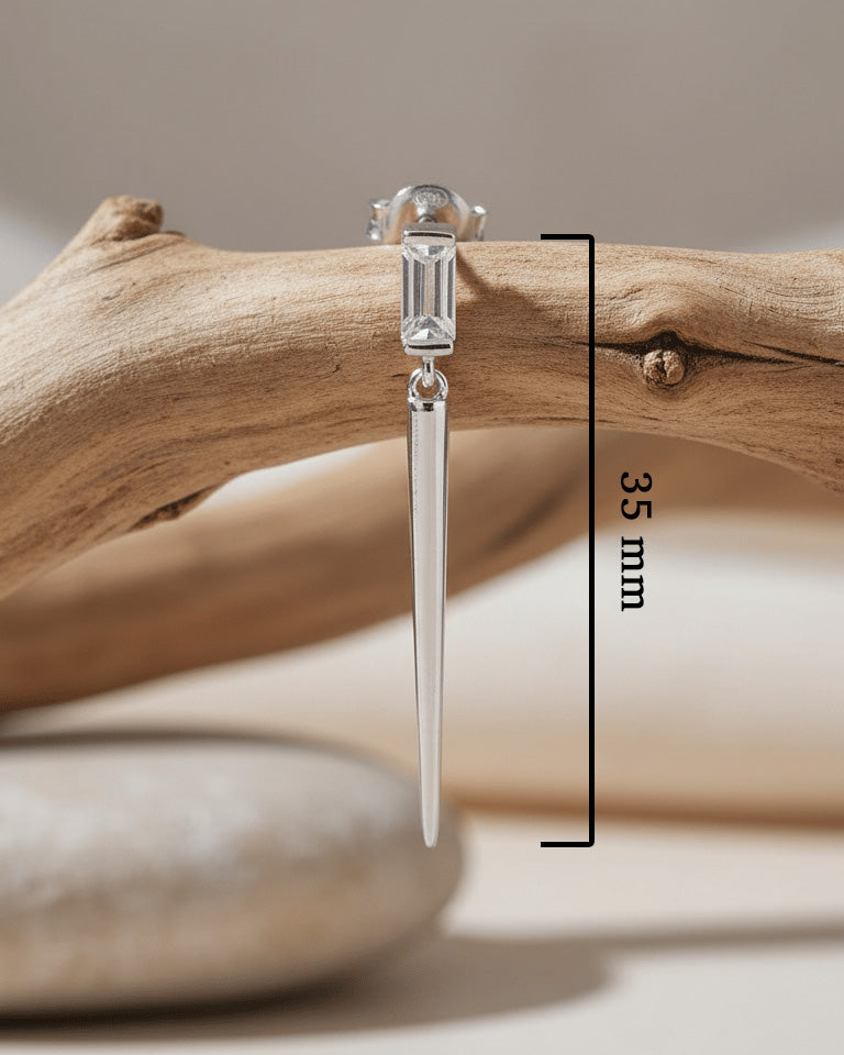 Baguette stone stud earring with dangling cone shape.