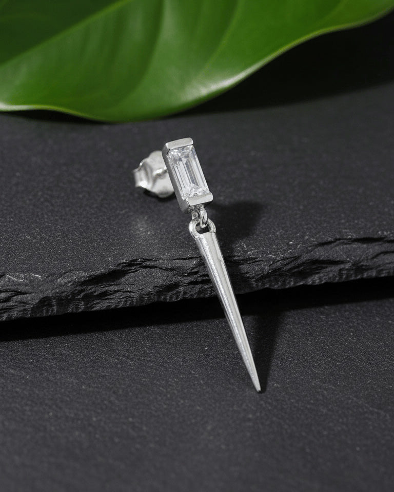Baguette stone stud earring with dangling cone shape.