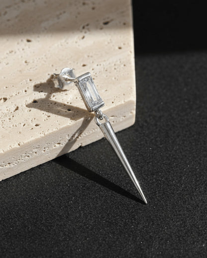 Baguette stone stud earring with dangling cone shape.