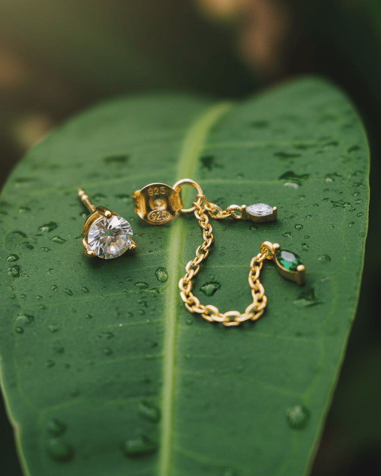 single stone stud earring with back dangling chains.