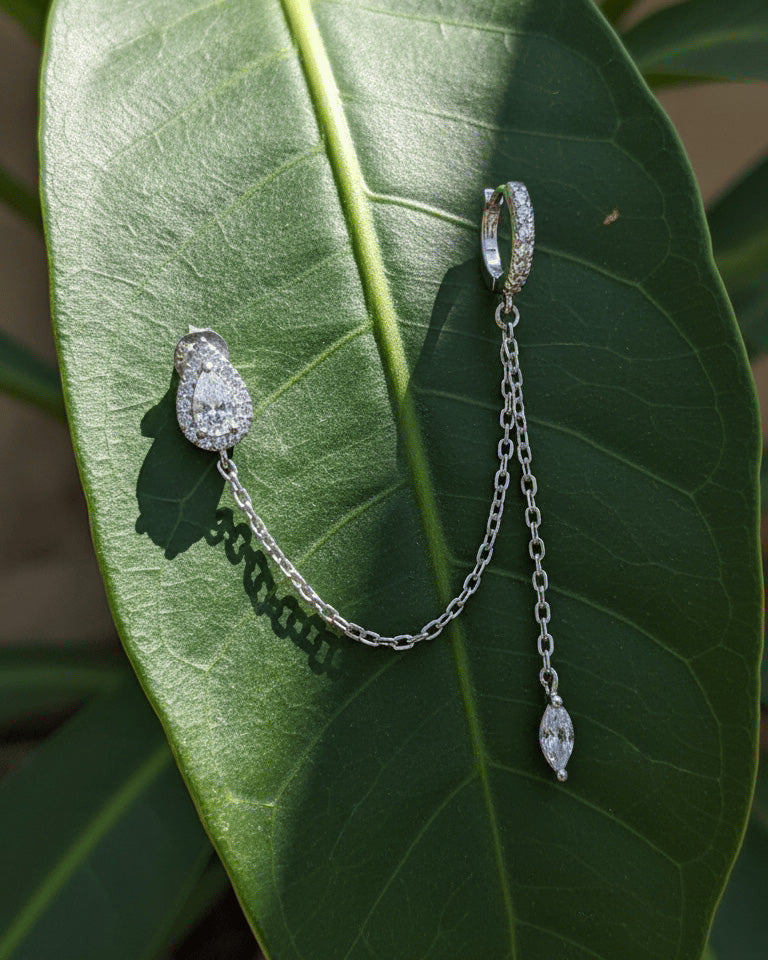 CZ pear shape stud chain-linked to hoop with dangling marquise shape.