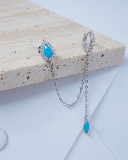 turquoise pear shape stud chain-linked to hoop with dangling marquise shape.