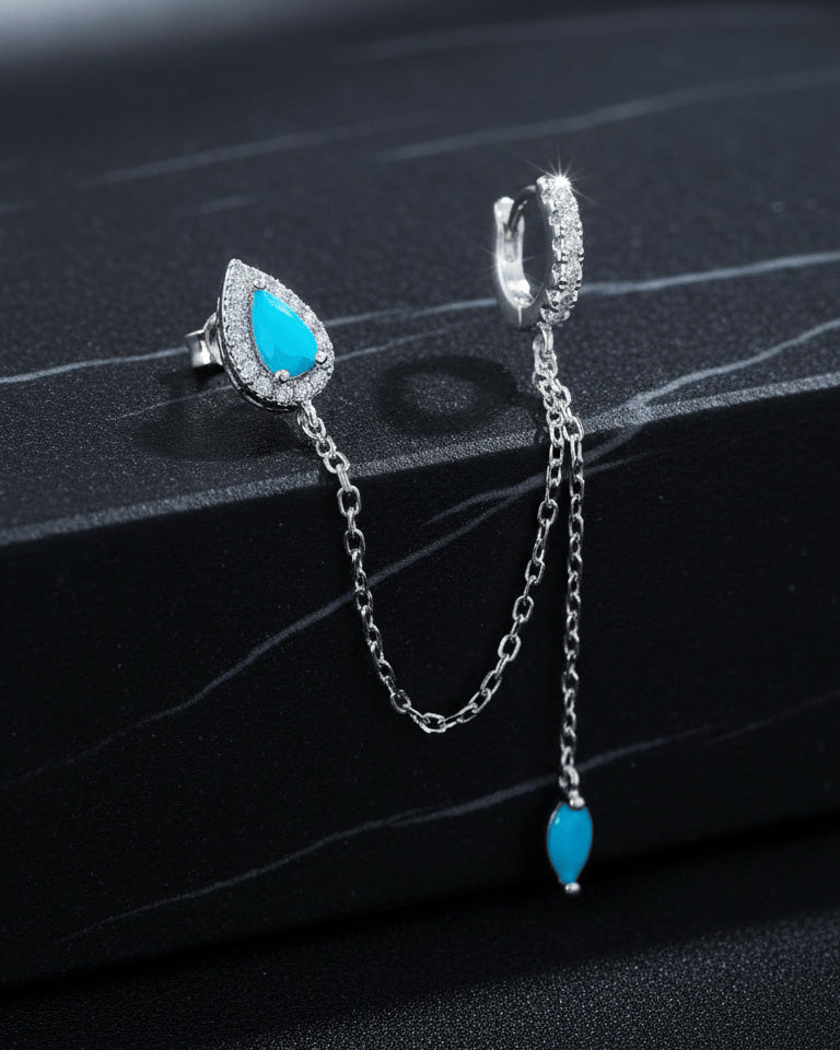 turquoise pear shape stud chain-linked to hoop with dangling marquise shape.