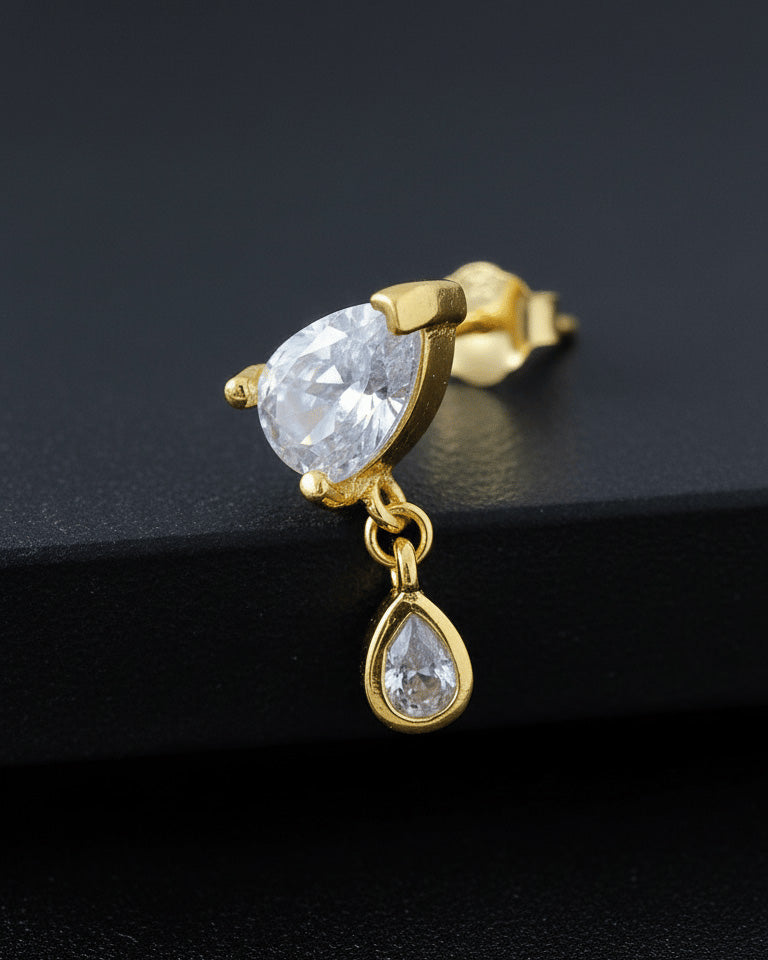 pear shape in prong setting with a dangling smaller pear in bezel setting stud earring.