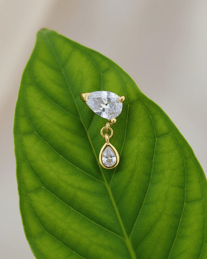 pear shape in prong setting with a dangling smaller pear in bezel setting stud earring.