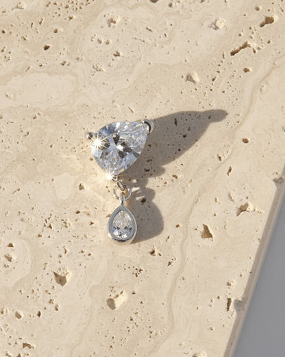 pear shape in prong setting with a dangling smaller pear in bezel setting stud earring.