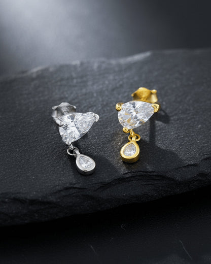 pear shape in prong setting with a dangling smaller pear in bezel setting stud earring.