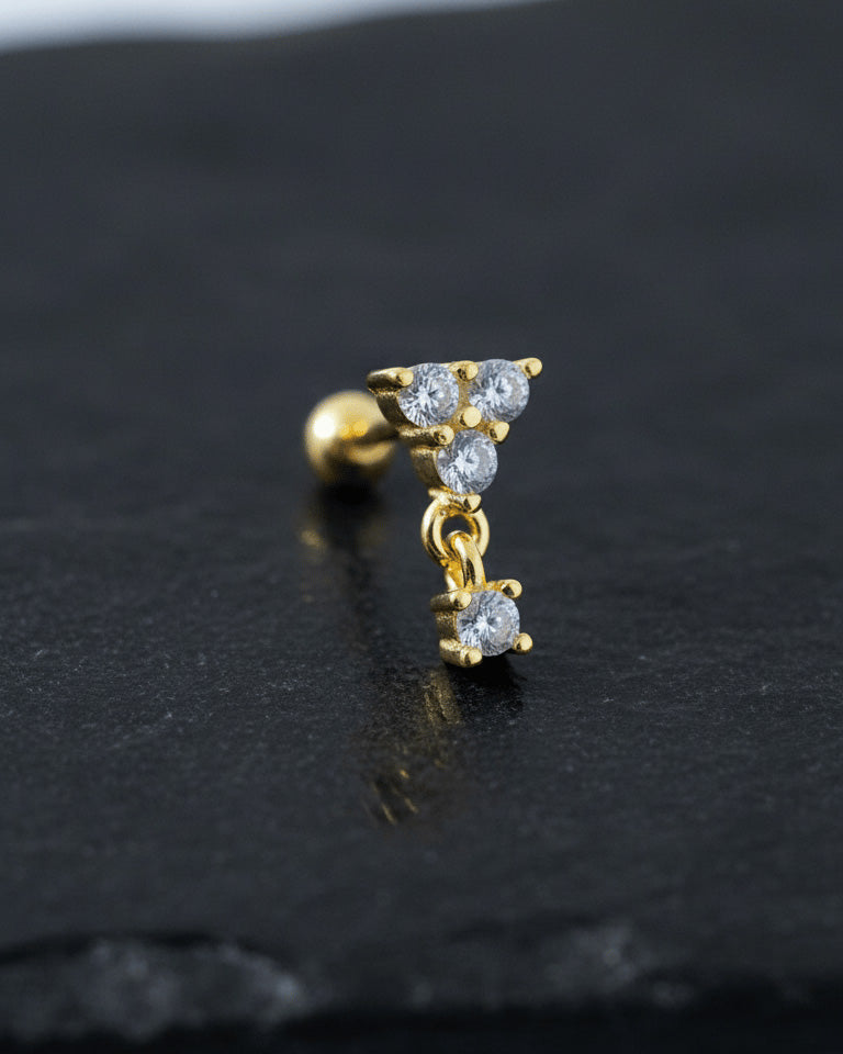 round three stones with dangling one ballback piercing earring.