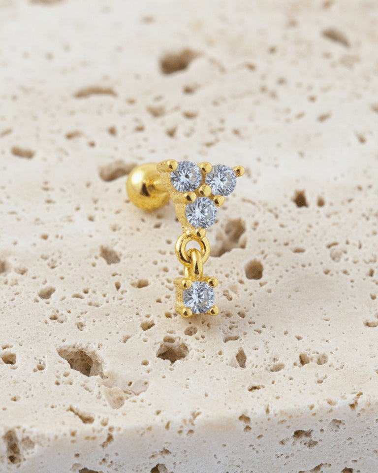 round three stones with dangling one ballback piercing earring.