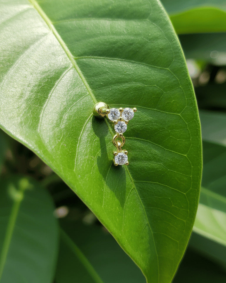 round three stones with dangling one ballback piercing earring.
