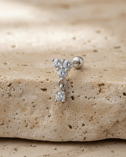 round three stones with dangling one ballback piercing earring.