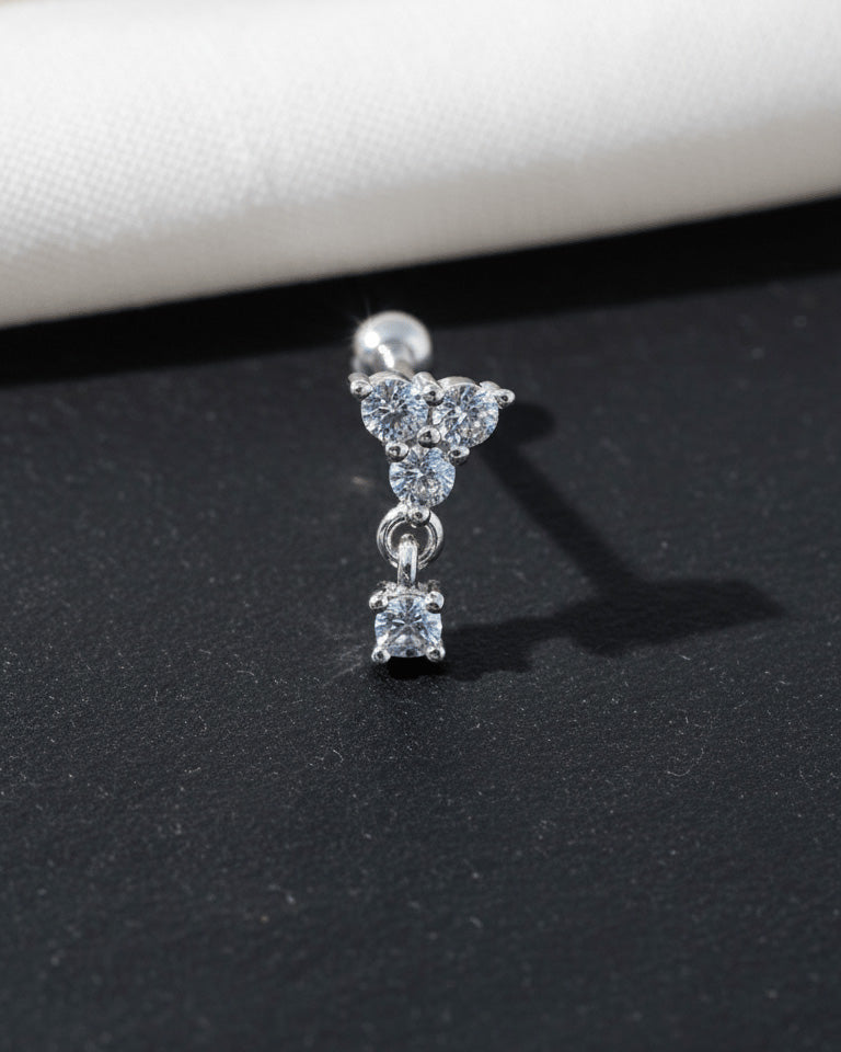 round three stones with dangling one ballback piercing earring.