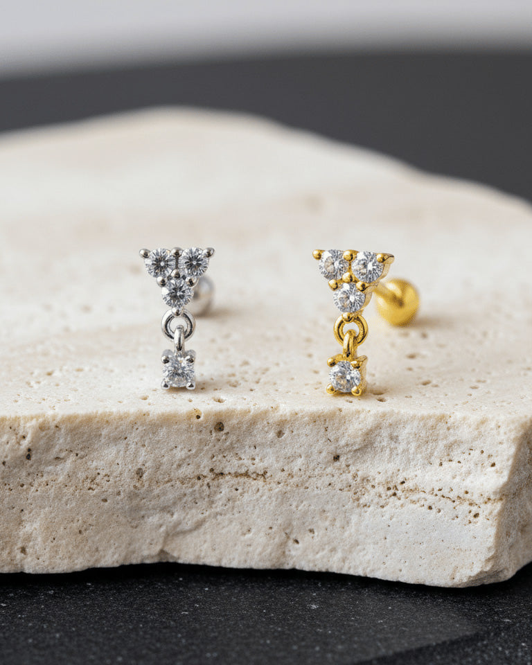 round three stones with dangling one ballback piercing earring.