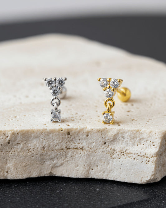 round three stones with dangling one ballback piercing earring.